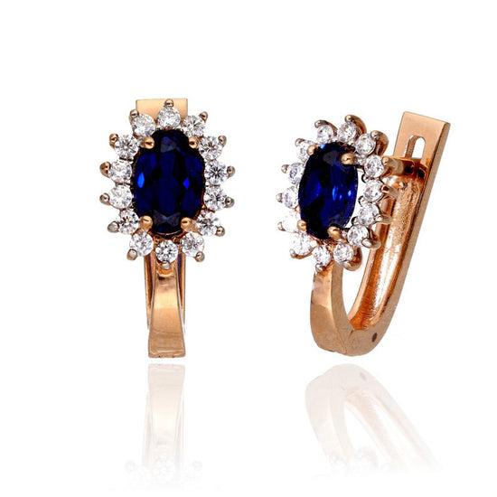 Auksiniai auskarai su mėlynu akmeniu