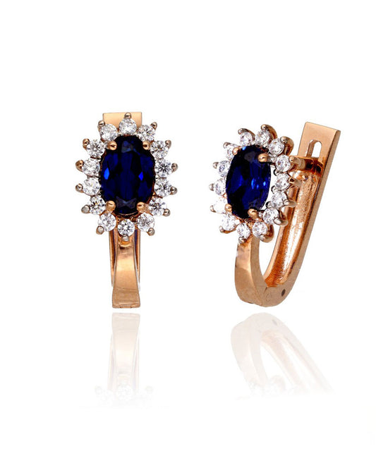 Auksiniai auskarai su mėlynu akmeniu