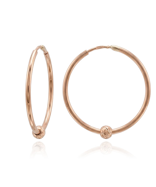 Rose gold earrings with a knot