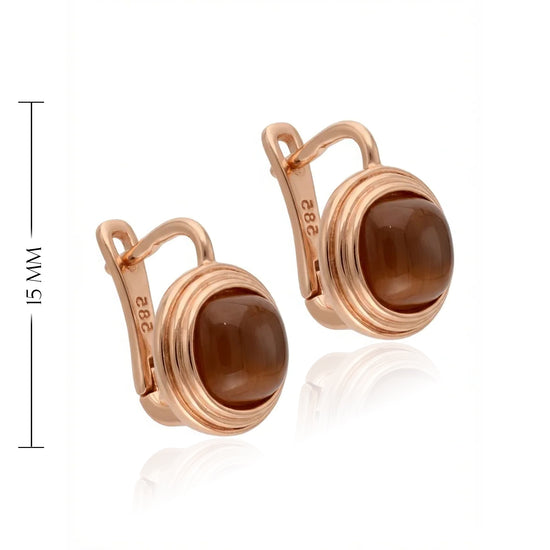 Auskaro pora su natūralia tigro akimi rožiniame aukse