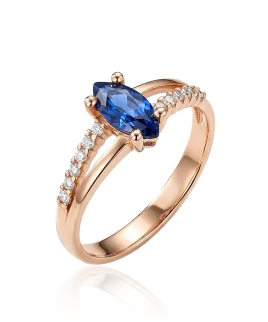 Red gold ring with blue zircon and side holes
