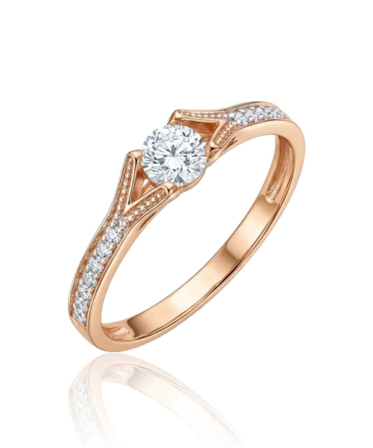 Red gold ring with white central zircon and side holes